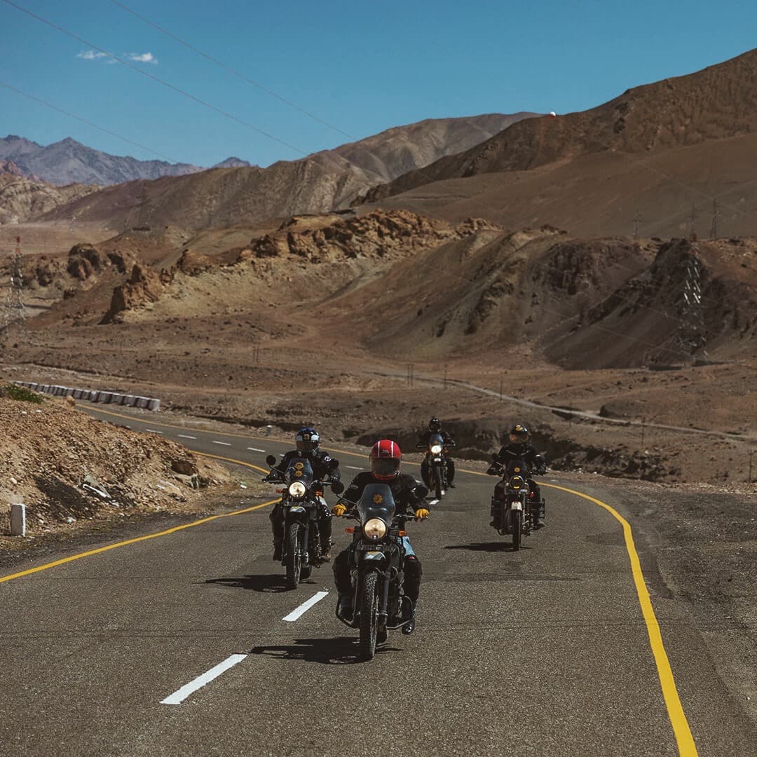 Man on Royal Enfield bike in the Himalaya