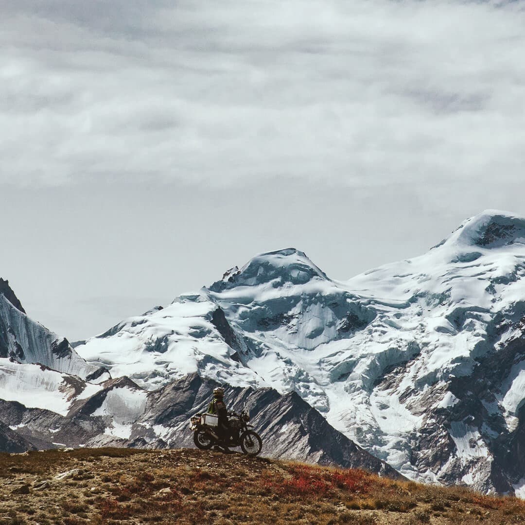 Man on Royal Enfield bike in the Himalaya