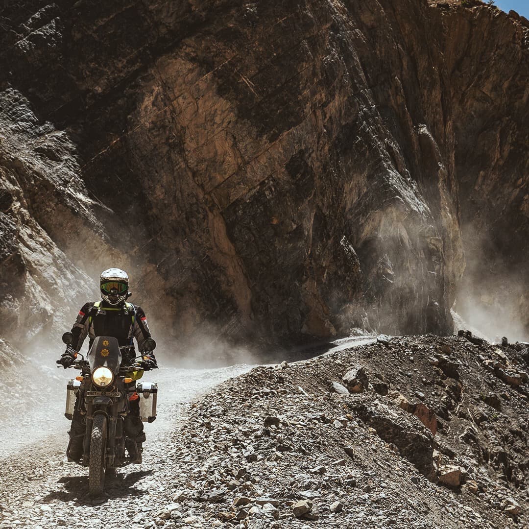 Man on Royal Enfield bike in the Himalaya