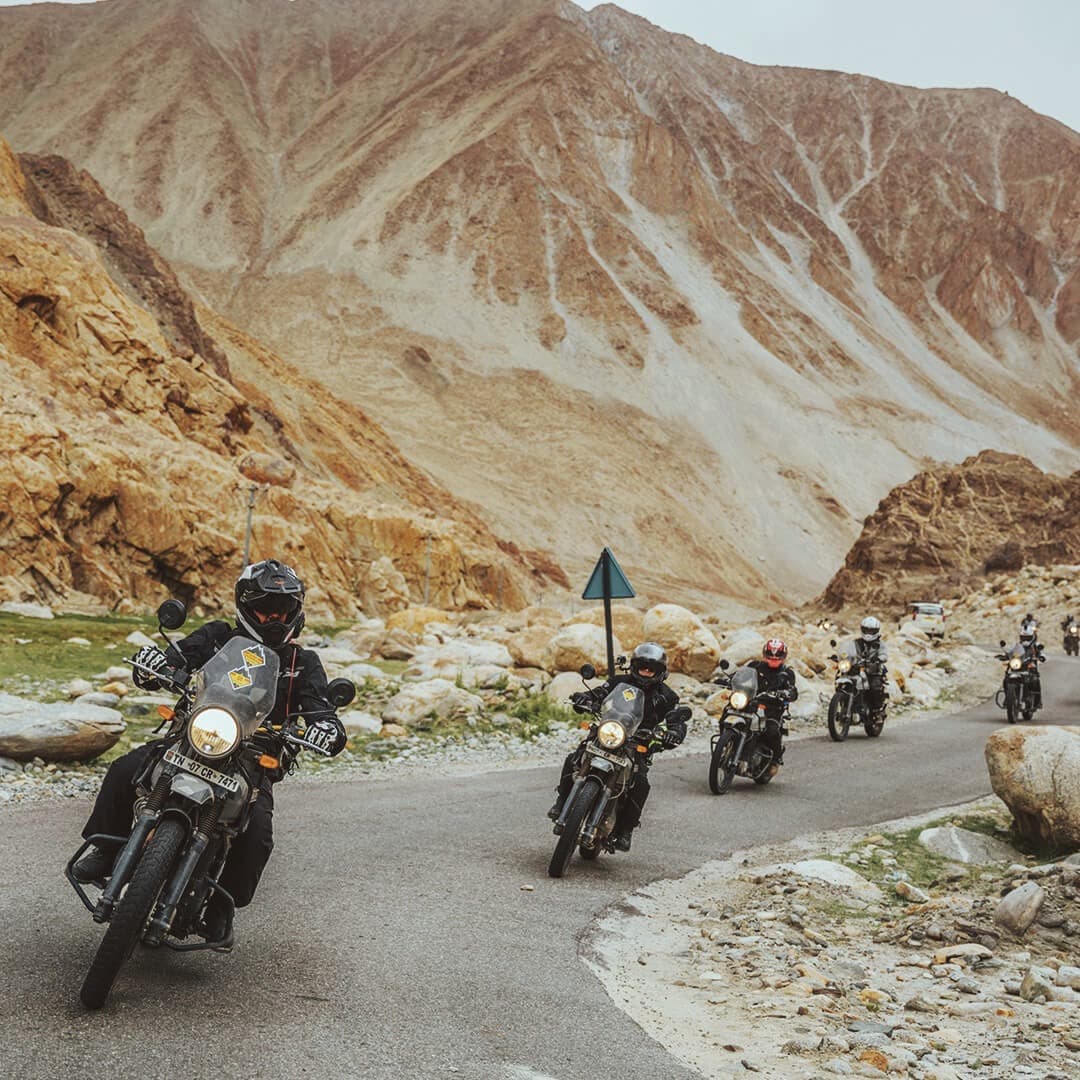 Man on Royal Enfield bike in the Himalaya