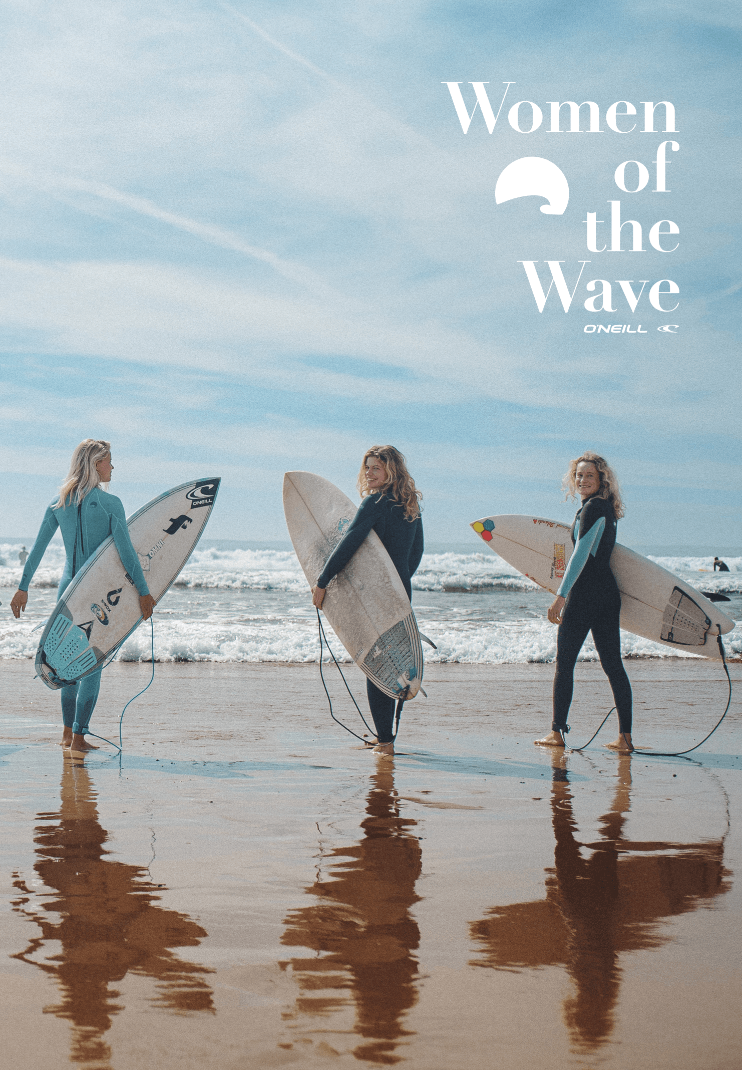 Girls with surfboards at the beach