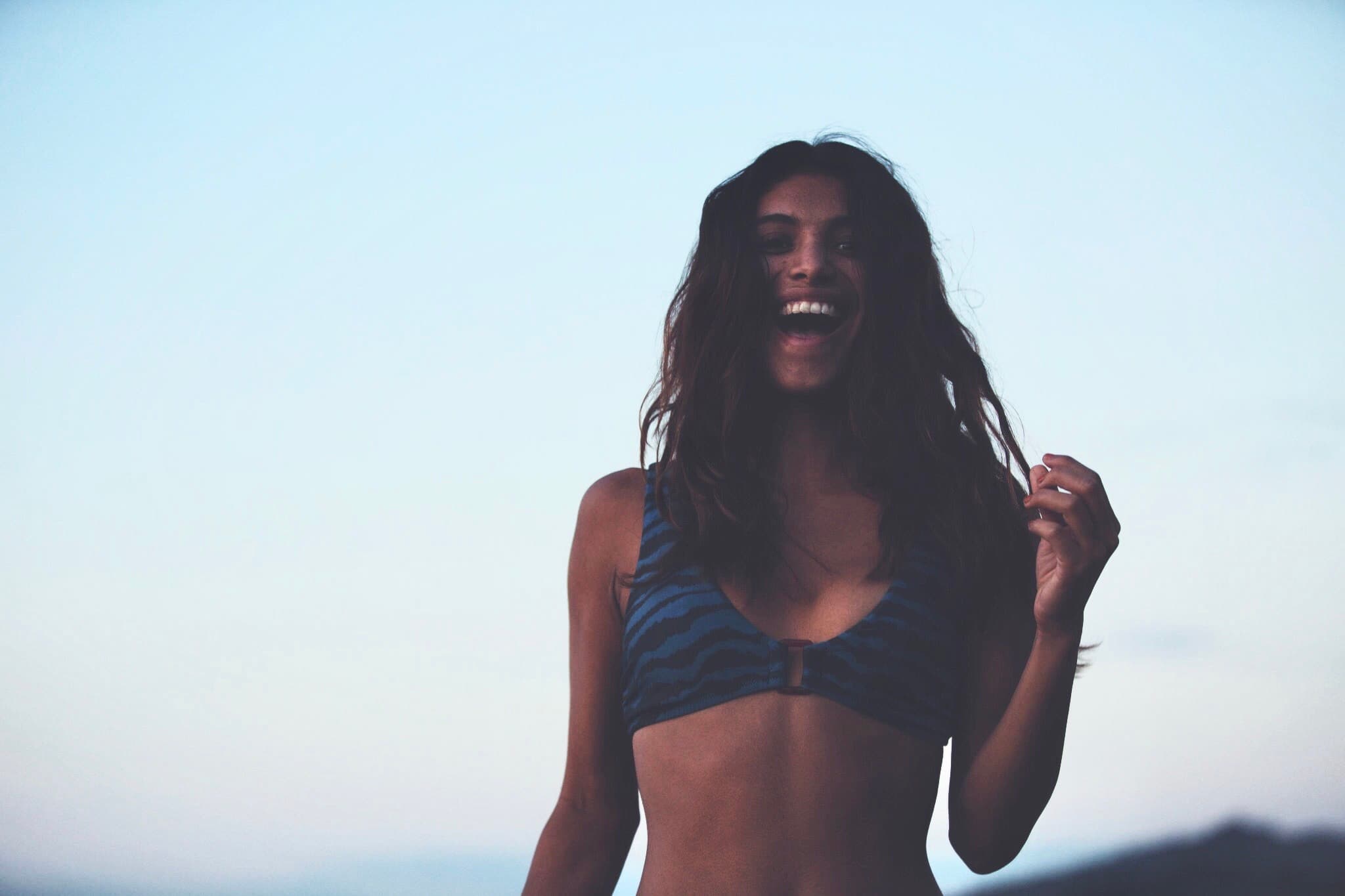 Girl laughing at the beach