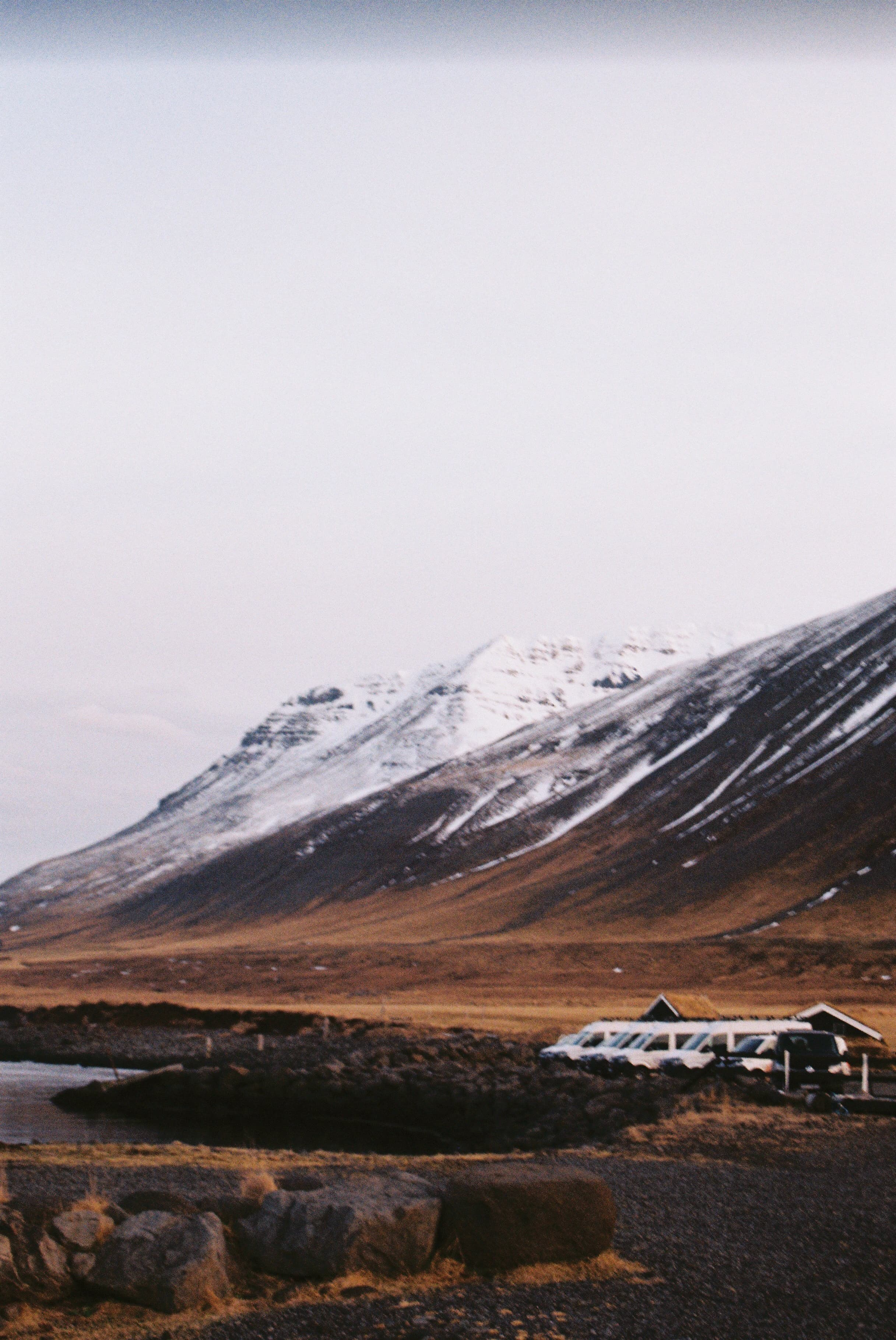 Vans Parked under a mountain in Iceland