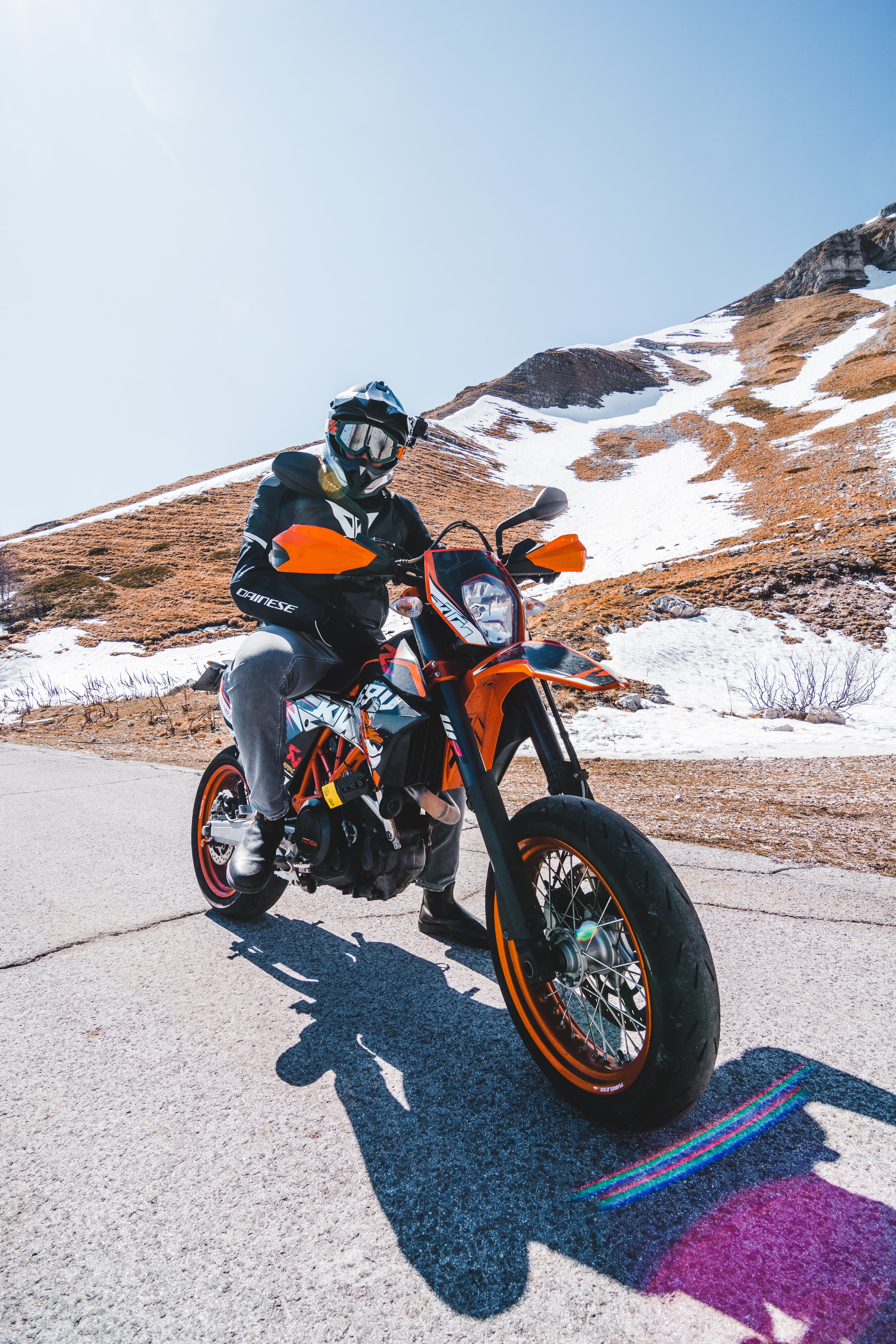 Guy posing on top of a KTM enduro bike