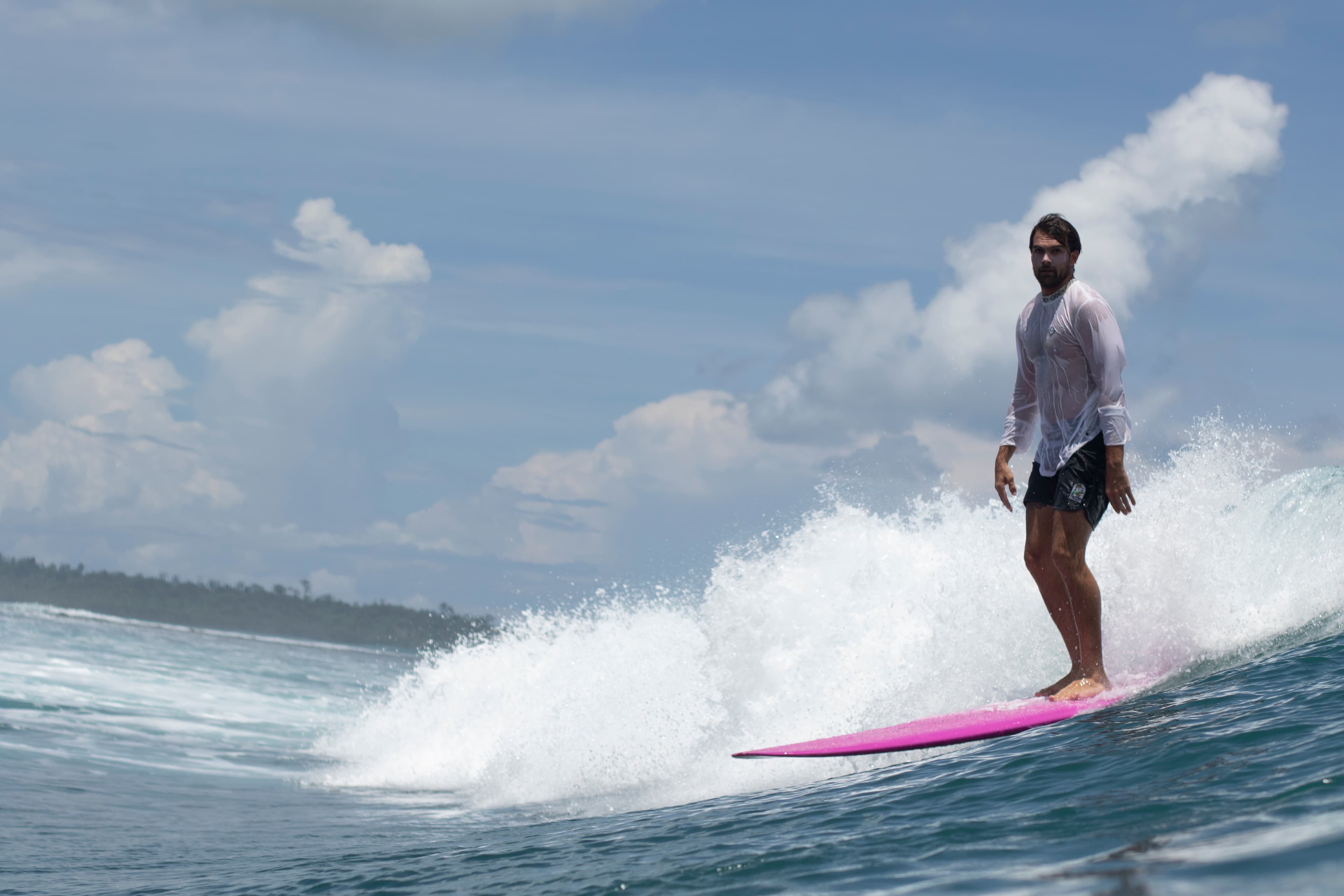 Man Longboarding in Alaia