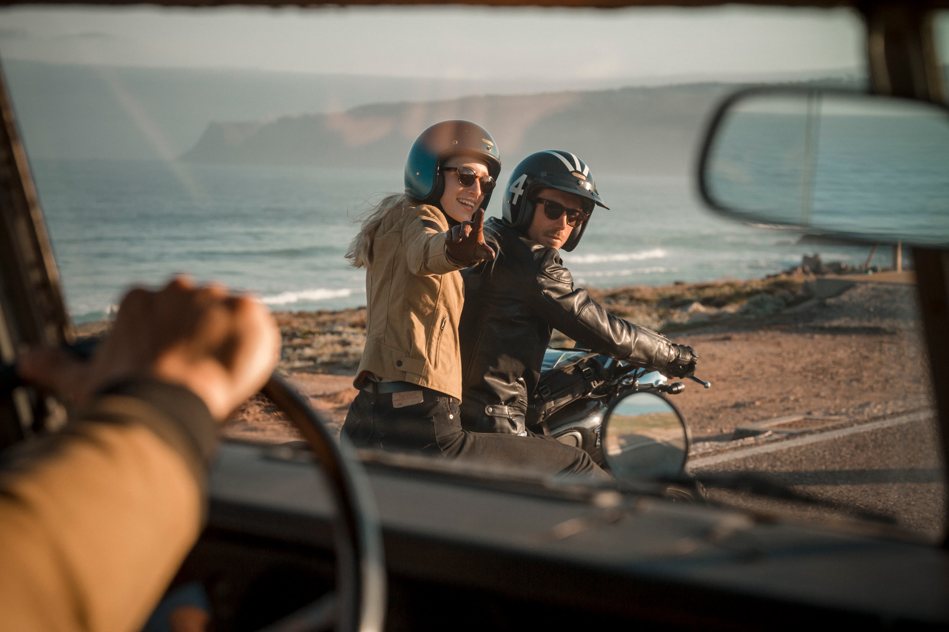 Jorge Abian and Katha riding in a Triumph Motorbike in Portugal. Praia do Guincho
