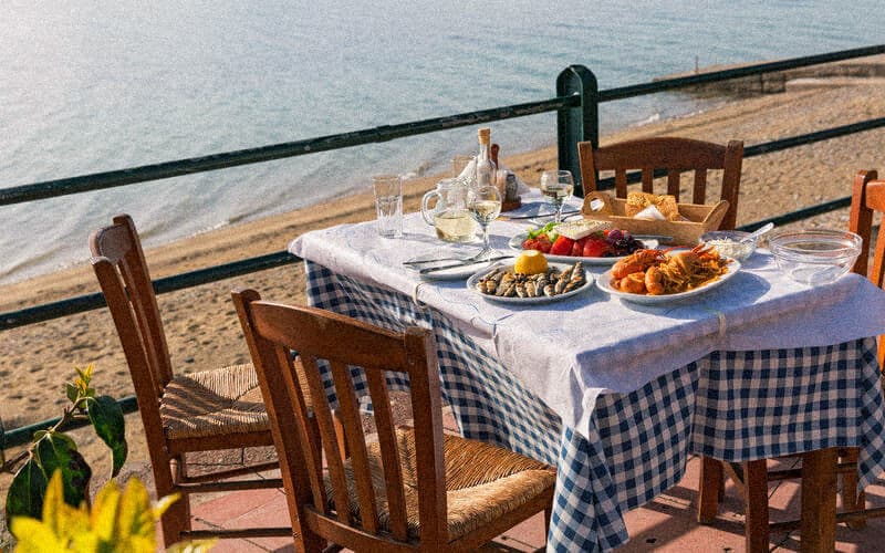 Table by the sea with seafood in Denia, Spain