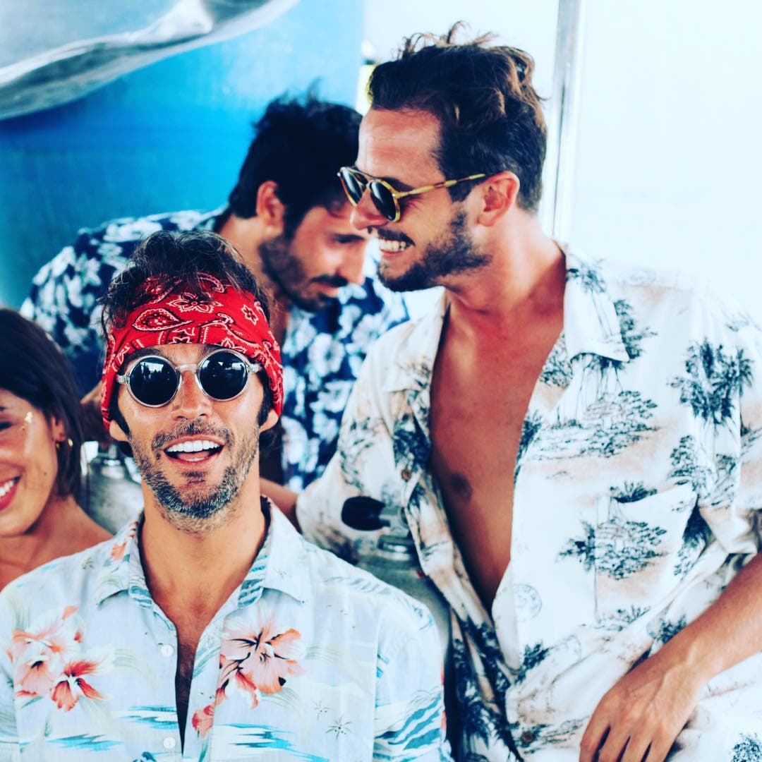 Guys dressing with Hawaiian shirts smiling in the Maldives