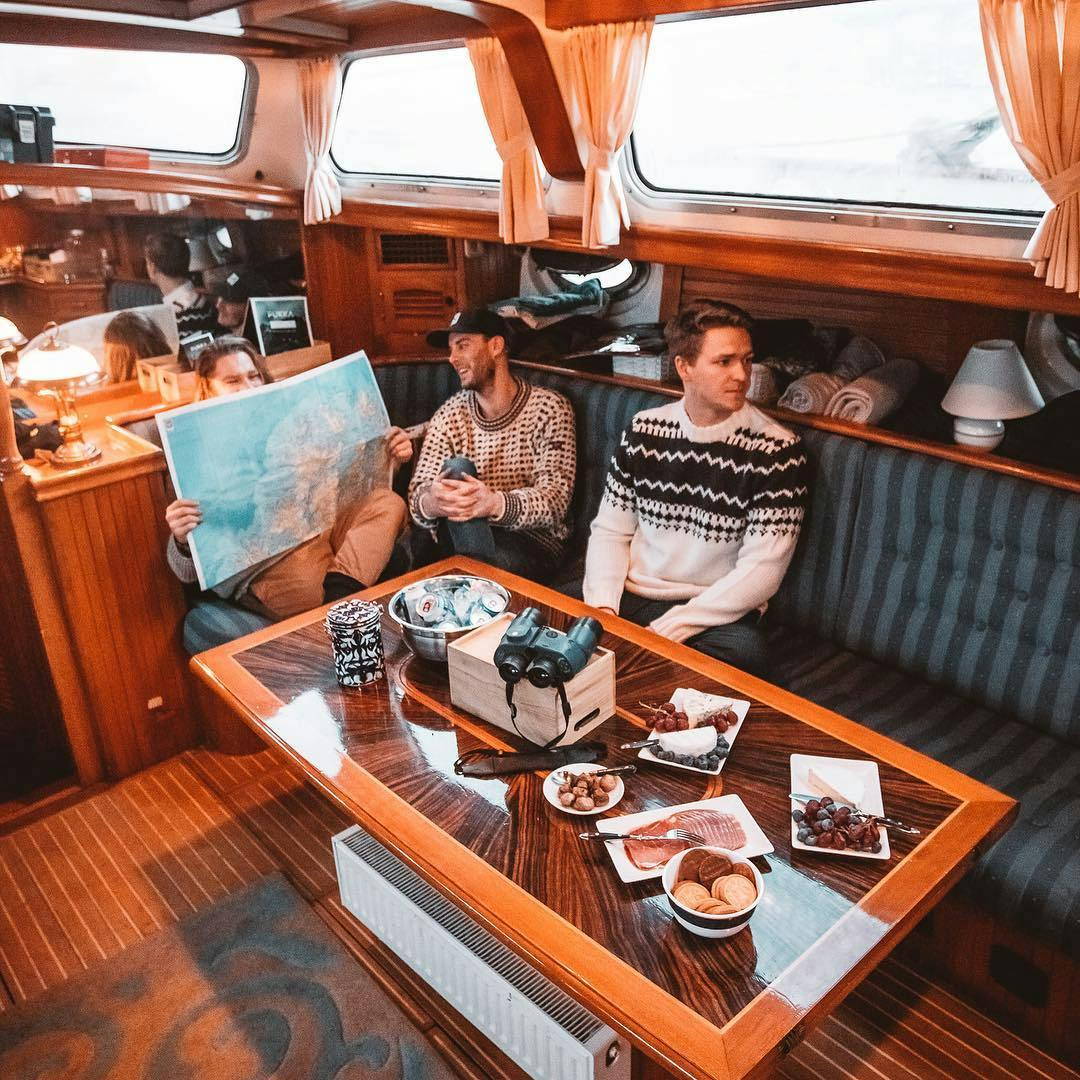 Friends unwinding inside the yacht