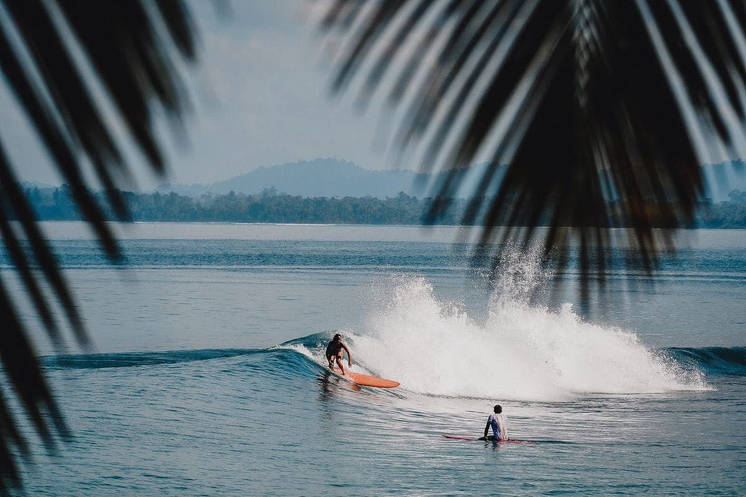 Surfing in with Longboard in the Mentawais