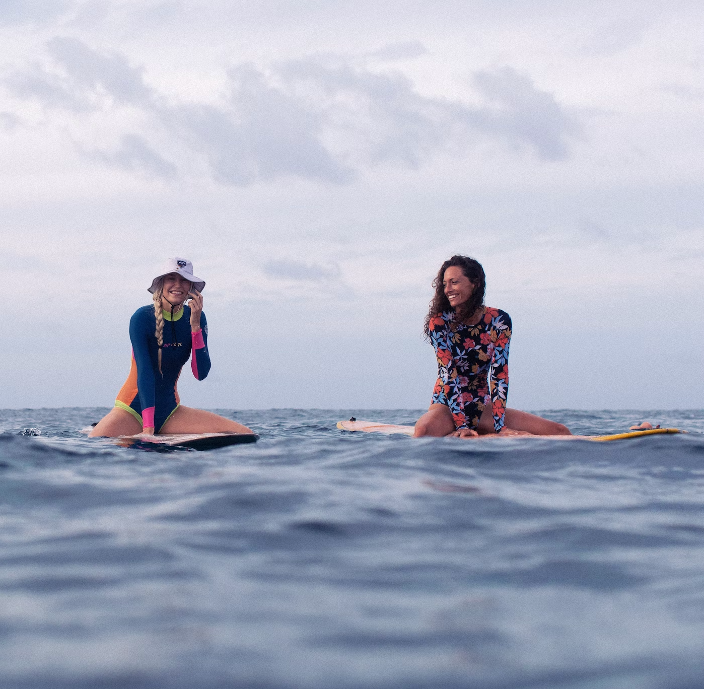 Kunna Haan and Kate surfing in the Maldives with Land of Ride