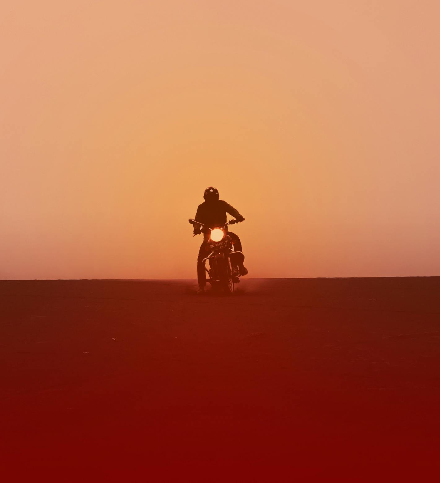 Jorge Abian on top of a bike in the desert.