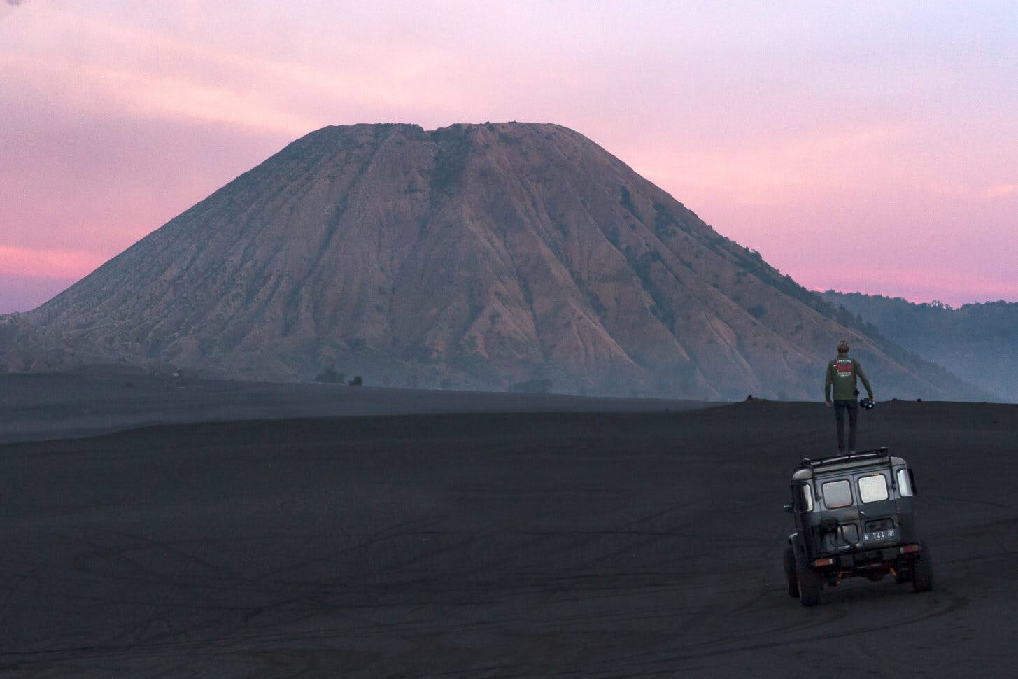 Jorge Abian standing on top of a Toyota 4X4 in a Volcano in Java, Indonesia