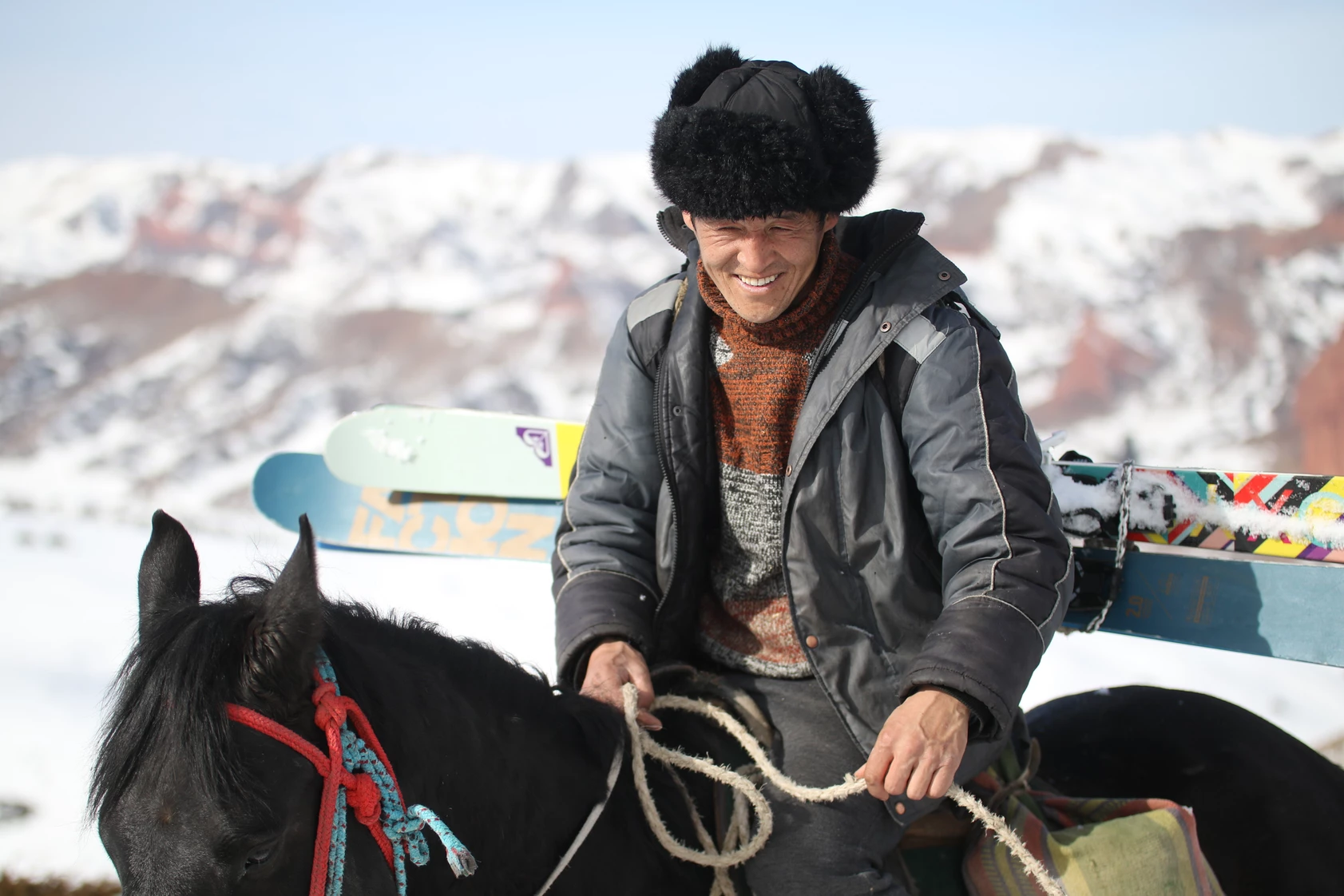 Kyrgyztan Horse Ski Tour Guide riding on a horse
