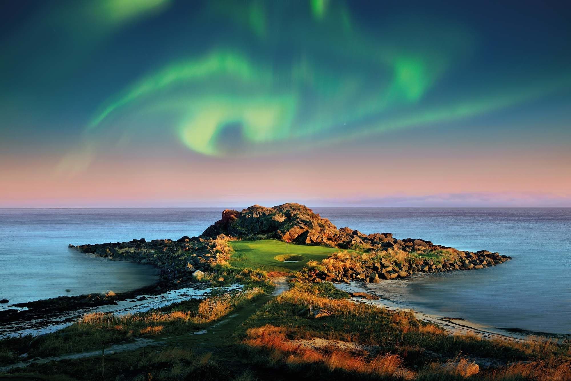 A golf hole in Lofoten Links Golf club under the northern lights