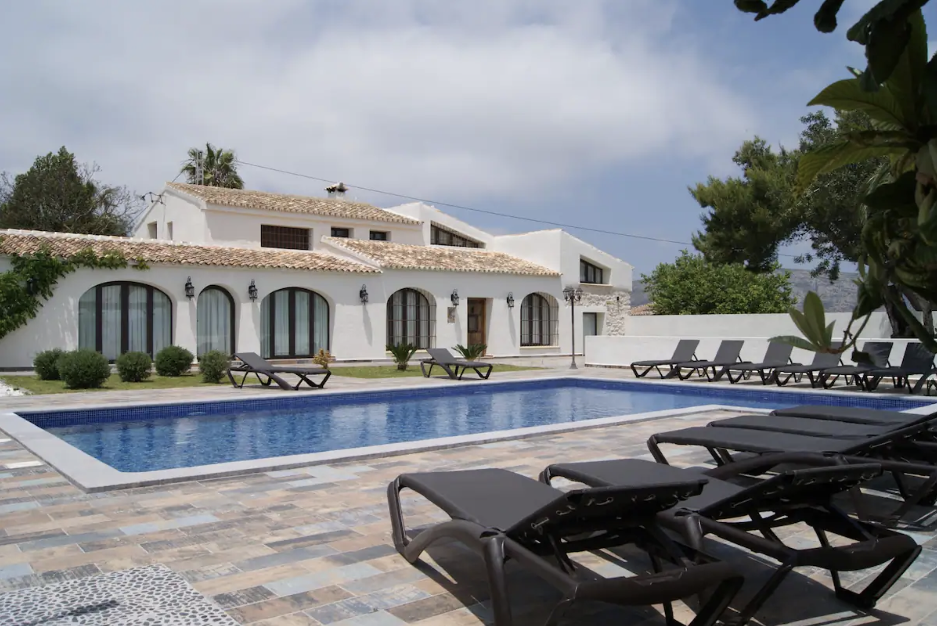 Poolside with a view of the villa in Moraira