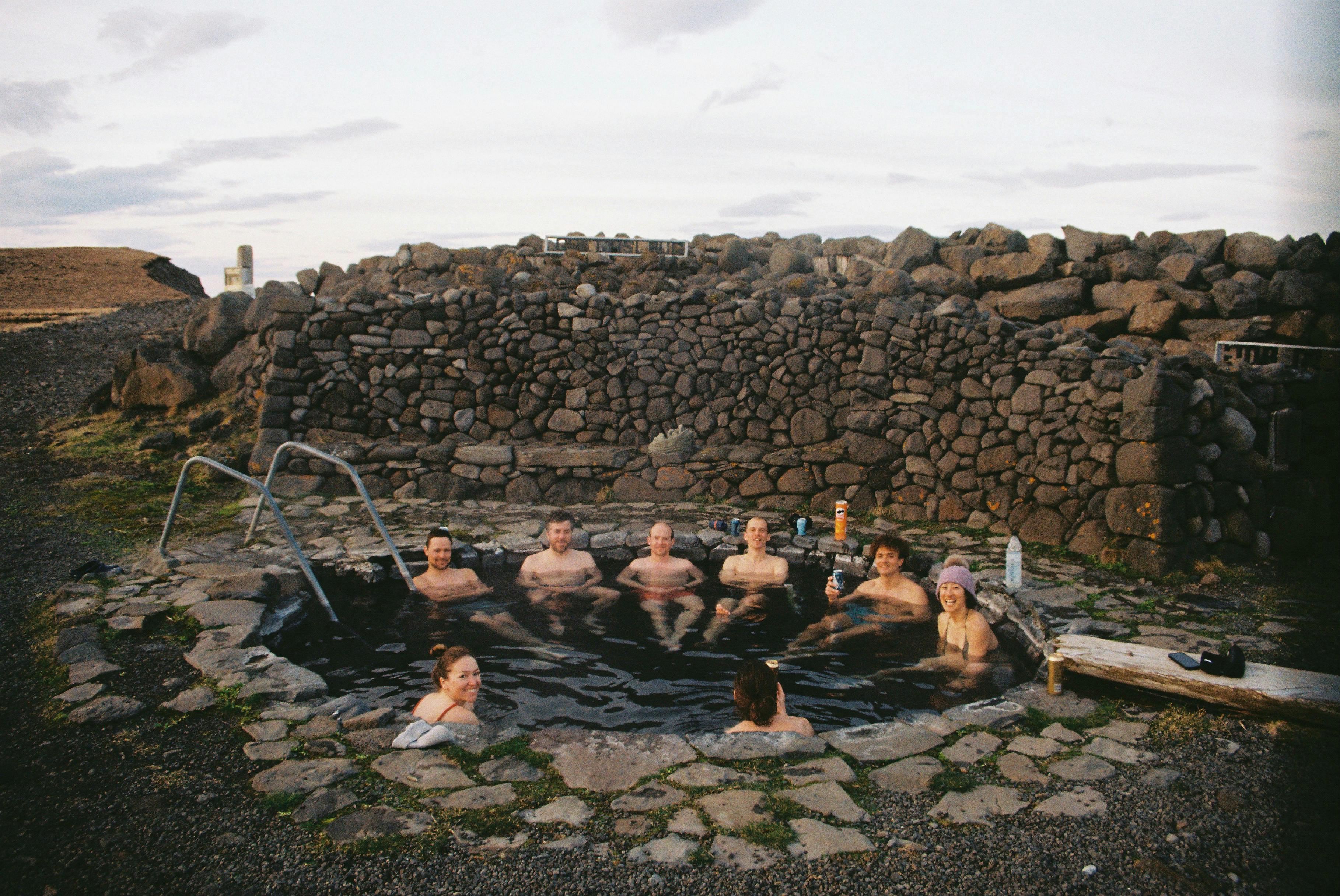 A group of friends enjoying a hot spring in Iceland