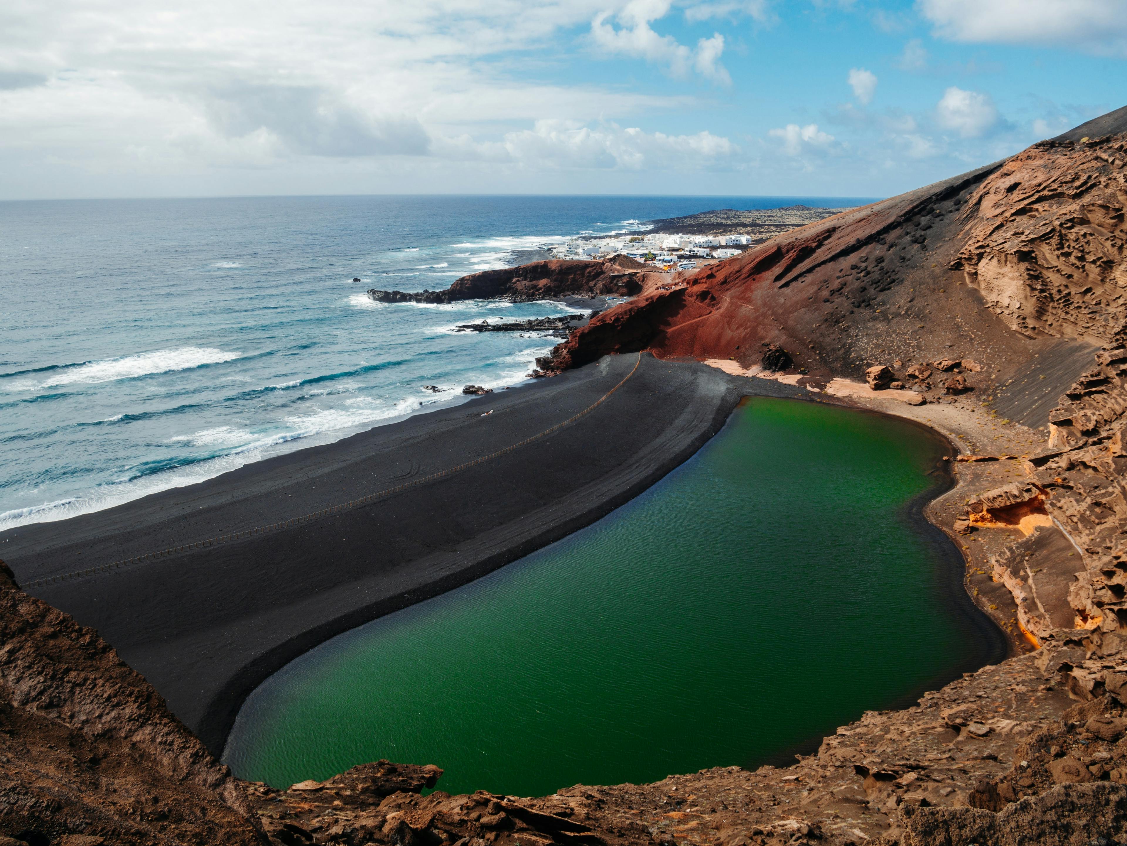 Lanzarote Impossible Landscape with a lake, black sand and teh ocean