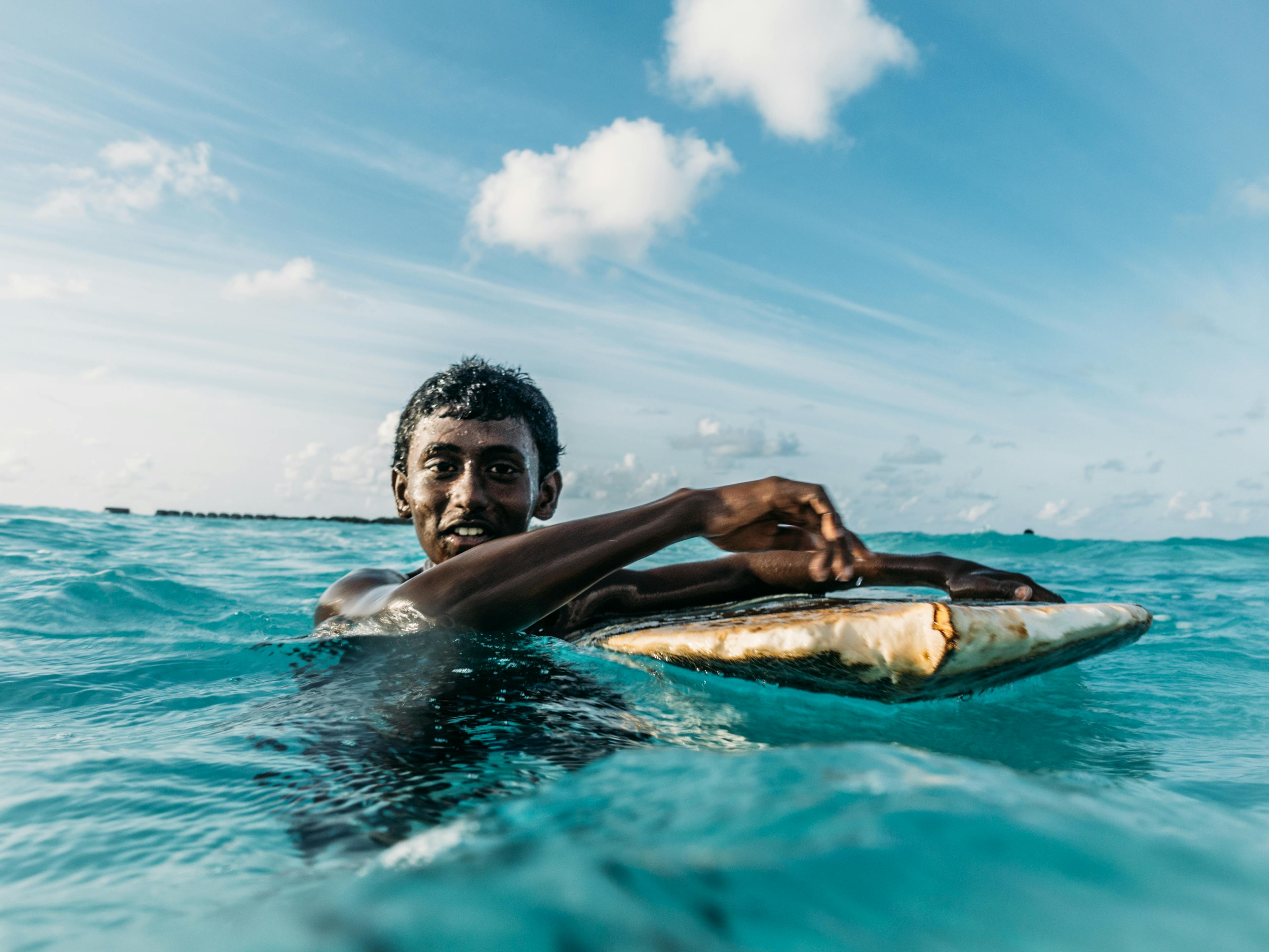 Local Surfer boy in the Maldives