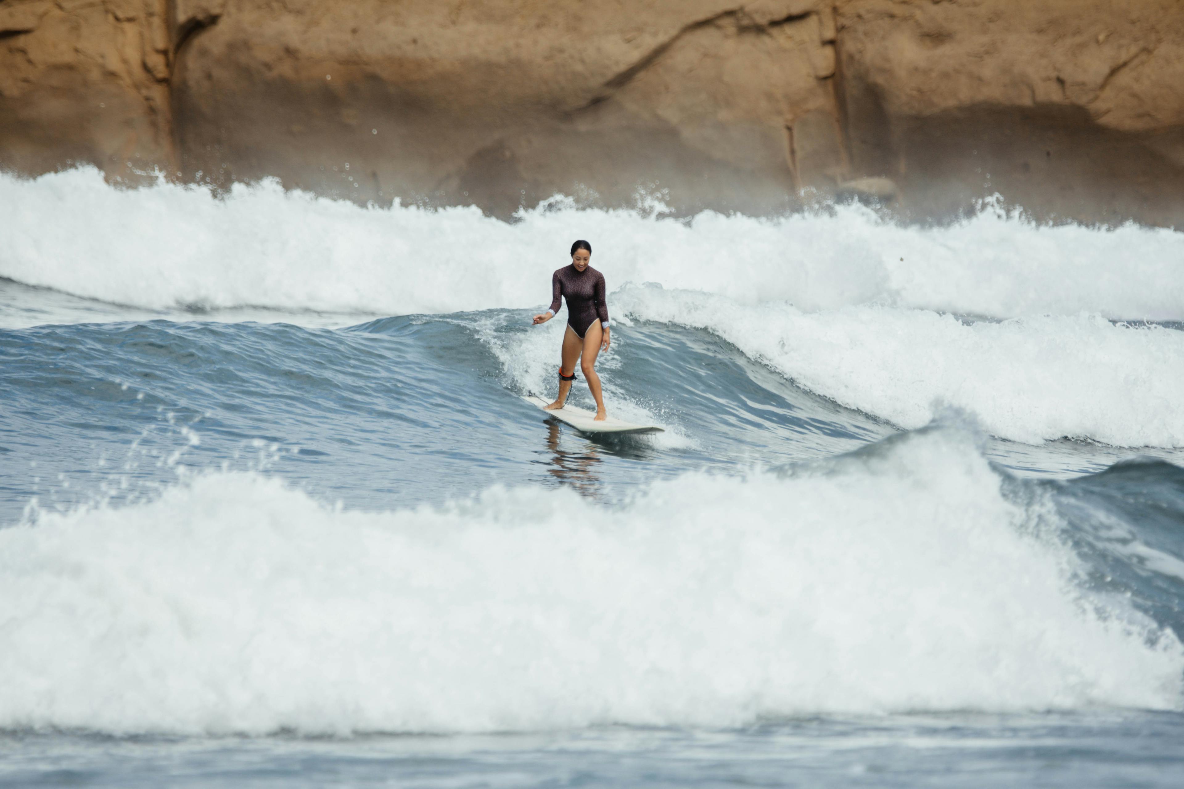 Girl surfing in Ecuador Land of Ride