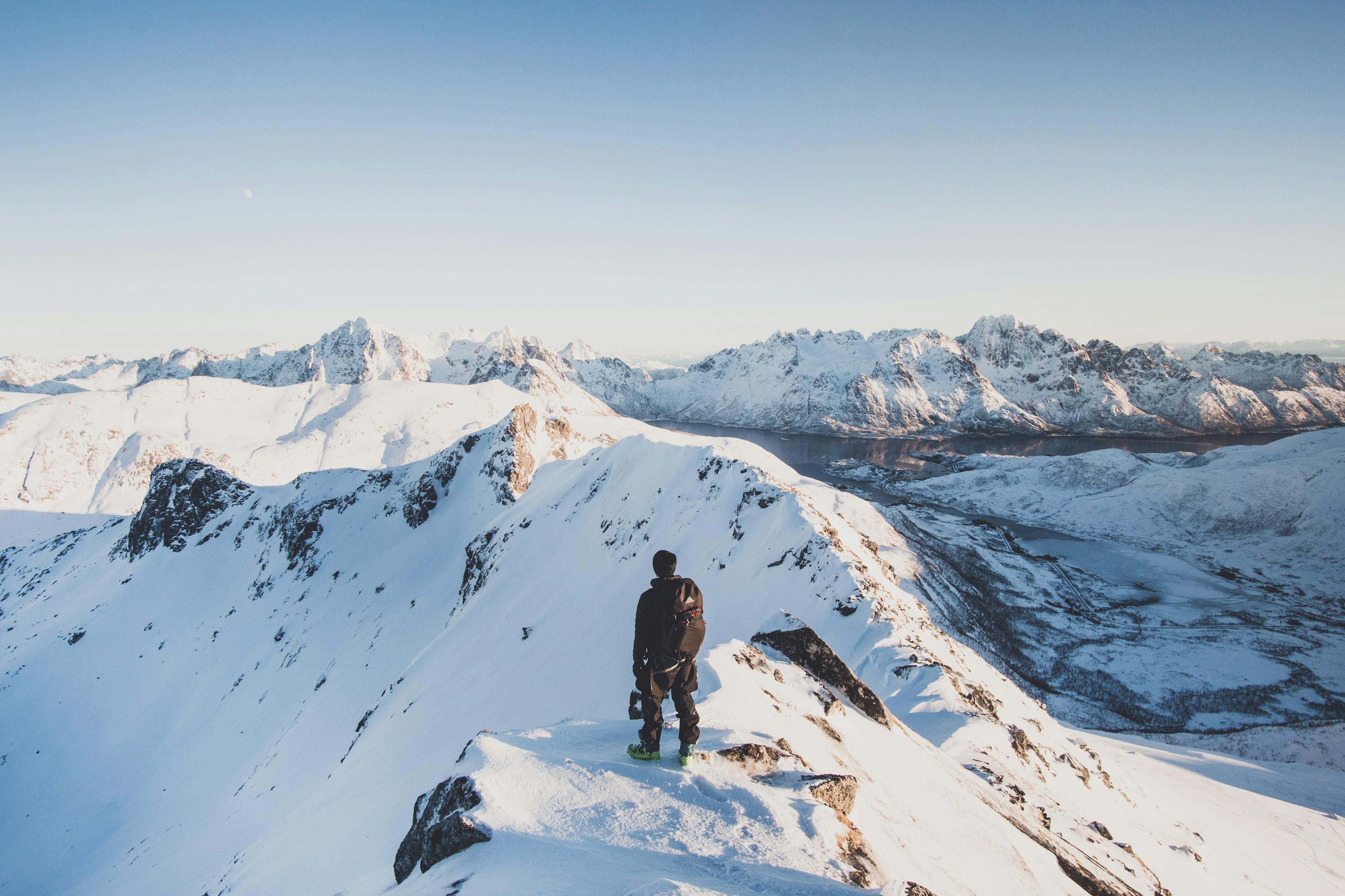 Guy standing in Mountain in the Lyngen Alps